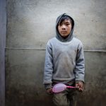 Nepali Nintendo, © Simon Sharp, Croston, Lancashire, United Kingdom, Professional : Babies/Children, PDN Faces - Portrait Photography Contest