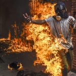 Demonstrator Catches Fire, © Juan Barreto, Venezuela, 3rd prize stories, World Press Photo Contest